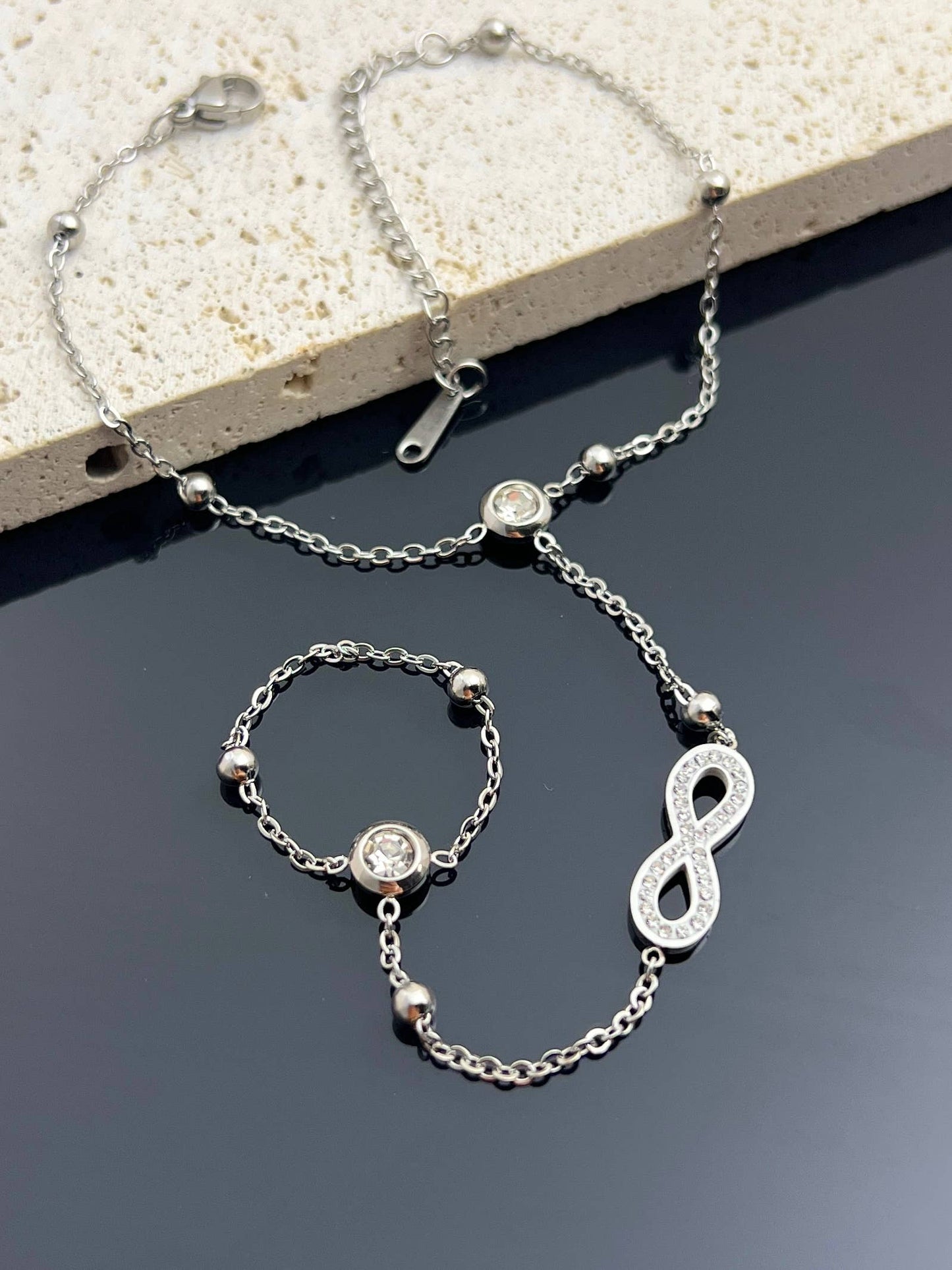Pulseira de mão infinita em aço inoxidável